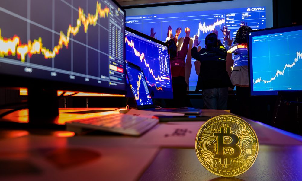 Golden bitcoin cryptocurrency token on desk