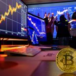 Golden bitcoin cryptocurrency token on desk